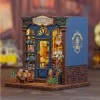 A miniature model of a bookshop with lights on. Náhled obrázku produktu