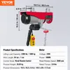 A red electric hoist with a control pendant is shown against a white background, with dimensions and specifications overlaid. Náhľad obrázku produktu