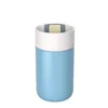 A product shot of a blue thermos with a white band and a gray and yellow lid. Náhled obrázku produktu