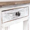 A close-up view of a drawer on a wooden table with a distressed white finish and a dark knob. Náhled obrázku produktu