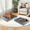 Two dogs sleeping on dog beds in a living room. Produktbild-Vorschau