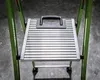 A close-up view of the platform and handle of a green Little Giant MightyLite ladder. Podgląd zdjęcia produktu