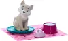 A toy fox figurine with accessories on a pink patterned mat. Produktbild-Vorschau