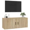 A wall-mounted TV cabinet with a television above it, and decorative items on top of the cabinet. Voir les images du produit
