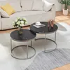 A living room setting with a sofa, coffee tables, and a rug. Voir les images du produit