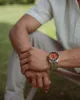 A person wearing a watch outdoors. Podgląd zdjęcia produktu