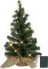 A small, artificial Christmas tree decorated with warm white LED lights and a burlap base. Produktbild-Vorschau