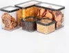 A collection of clear plastic food storage containers filled with various food items, arranged on a white background. Produktbild-Vorschau