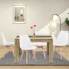 A dining table with four chairs in a room. Náhled obrázku produktu