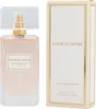 A bottle of Givenchy Dahlia Divin Eau de Parfum and its packaging are displayed side-by-side against a white background. Produktbild-Vorschau