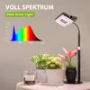 A desk grow light with a spectral graph and several potted plants. Produktbild-Vorschau