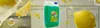 A bottle of dish soap with lemons and bubbles around it, suggesting a fresh and clean scent. Náhled obrázku produktu