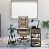 An office chair and desk setup in a room with a large blank picture frame on the wall. Voir les images du produit