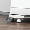 Close-up of the base of a white appliance on a transport roller with blue wheels. Voir les images du produit