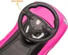 Close-up of a pink toy car's steering wheel and dashboard. Produktbild-Vorschau