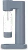 A studio shot of a gray soda maker with a clear bottle filled with water and bubbles. Podgląd zdjęcia produktu