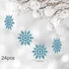 Hanging Christmas ornaments, including blue glitter snowflakes and white baubles with star patterns, against a blurred snowy background. Produktbild-Vorschau