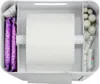 A top-down view of a white toilet paper holder with compartments containing feminine hygiene products and a roll of toilet paper. Produktbild-Vorschau