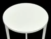 A close-up, top-down view of a white round table or stool against a black background. Produktbild-Vorschau