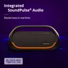 A black Tronsmart Bluetooth speaker with orange accents is shown against a purple background with blue wave-like graphics. Náhľad obrázku produktu