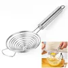 A stainless steel egg separator is shown on a white background, with an inset image showing it in use. Produktbild-Vorschau