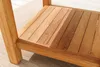 A close-up view of a wooden side table, showing the slatted surface and legs. Produktbild-Vorschau