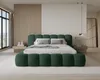 A modern bedroom with a green upholstered bed as the focal point. Voir les images du produit