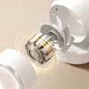 A close-up, exploded view of a white desk fan's internal motor and fan blades, with glowing yellow lines indicating energy flow. Produktbild-Vorschau