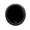 A top-down view of a black, circular washing machine. Produktbild-Vorschau