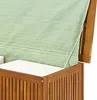 A close-up view of the top and side of a wooden storage box, partially covered by a green tarp. Podgląd zdjęcia produktu