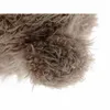 A close-up of the fuzzy texture of a teddy bear's paw. Podgląd zdjęcia produktu