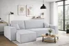 A modern living room with a sectional sofa, coffee table, and artwork. Produktbild-Vorschau