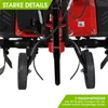Close-up view of the wheels and tines of a red and black garden tiller. Produktbild-Vorschau