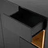A close-up view of an open drawer in a black cabinet, revealing a wooden interior. Podgląd zdjęcia produktu