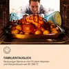 A person is looking into an oven at a roasted chicken with potatoes. Produktbild-Vorschau