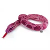 A plush snake toy is coiled on a white background. Produktbild-Vorschau