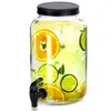 A glass beverage dispenser filled with water, ice, and slices of orange and lime. Produktbild-Vorschau