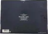 The back of a black Jägermeister box with product information and a barcode. Produktbild-Vorschau