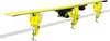 A yellow ski vise holding a ski and a ski boot, clamped to a white bar. Náhľad obrázku produktu