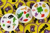 A close-up collage of cards from the Dobble game, showing various symbols on a yellow background with the game's logo. Voir les images du produit
