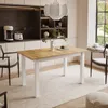 A dining room scene with a table and chairs, set up for a meal. Náhled obrázku produktu