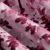 A close-up view of a pink and purple floral patterned fabric, likely bedding, with folds and creases. Produktbild-Vorschau