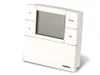 A white digital thermostat with a screen and buttons, set against a white background. Náhled obrázku produktu