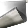 A close-up of a gray blackout roller blind partially unrolled from its roller. Anteprima dell’immagine prodotto