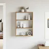 A wooden wall shelf with decorative items on it, set against a light-colored wall. Anteprima dell’immagine prodotto