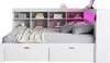 A white daybed with shelves and drawers, styled with a blanket and pillows. Produktbild-Vorschau