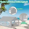 A grey party tent set up on a sandy beach with palm trees and the ocean in the background. Voir les images du produit