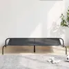 A black elevated dog bed is shown in a room with a white wall and a gray rug. Anteprima dell’immagine prodotto