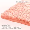 Close-up of a fluffy pink bath mat. Náhled obrázku produktu