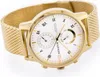 A close-up, studio shot of a gold Tommy Hilfiger watch with a white face and a mesh band, set against a white background. Voir les images du produit